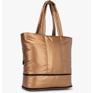 Luka expandable laptop tote. Soft puffy material. Copper color.
